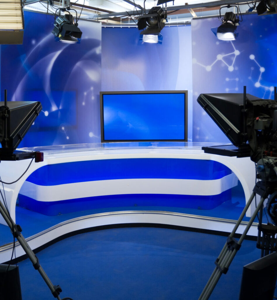 blue tv studio with cameras and lights