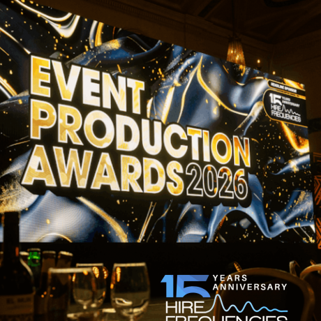 Large LED screen displaying the Event Production Awards 2026 branding above a set dinner table, with Hire Frequencies as AV supplier